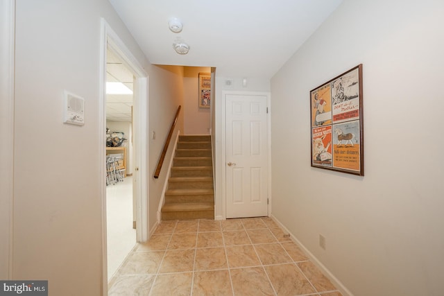 hallway featuring light tile patterned flooring