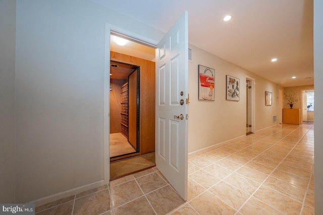 hallway featuring light tile patterned floors