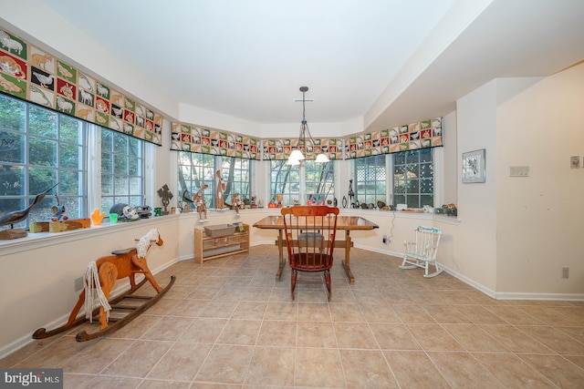 dining space featuring light tile patterned flooring