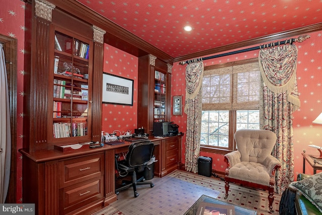 carpeted office space featuring ornamental molding and built in desk