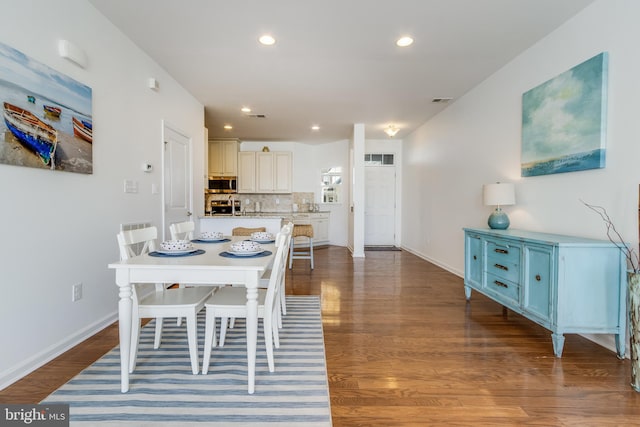 dining room featuring dark wood-type flooring