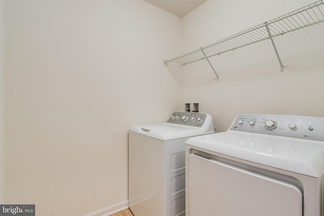 clothes washing area featuring washing machine and dryer