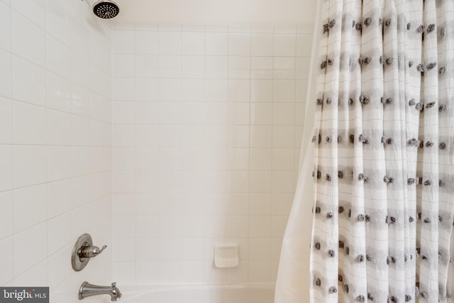 bathroom featuring shower / bath combo with shower curtain