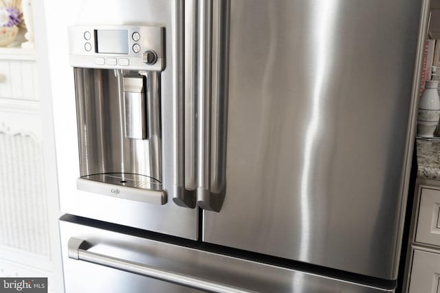 room details featuring stainless steel fridge