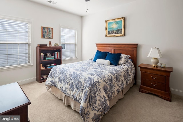 bedroom with light colored carpet