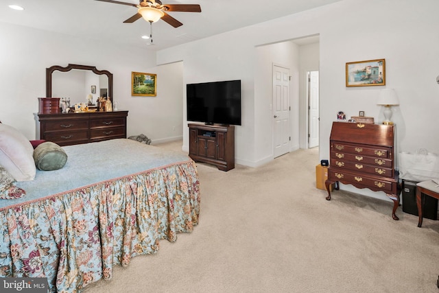 bedroom featuring light carpet and ceiling fan