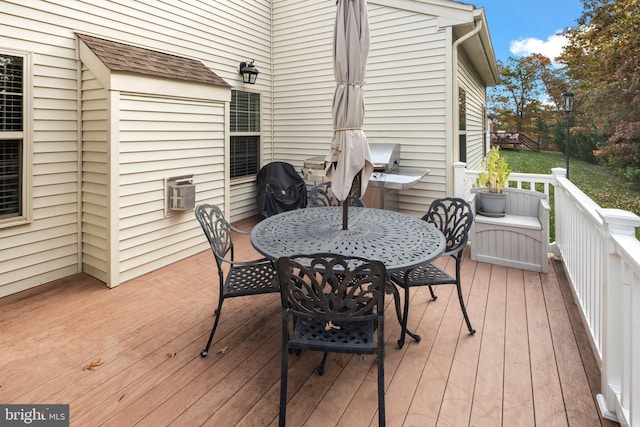 wooden terrace featuring area for grilling