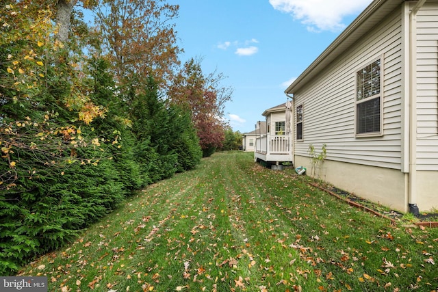 view of yard featuring a wooden deck