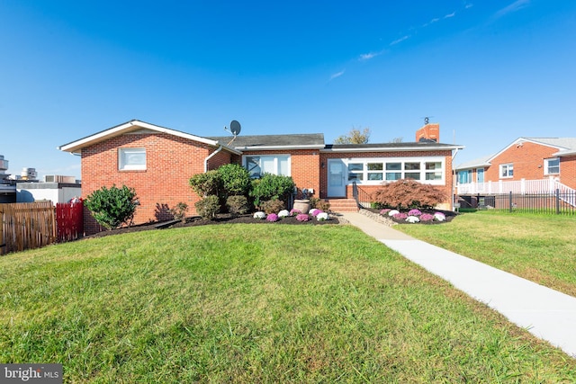 ranch-style house with a front yard