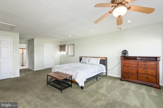 bedroom featuring a textured ceiling, carpet, and ceiling fan