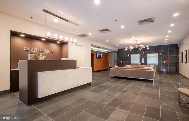 reception area featuring a chandelier