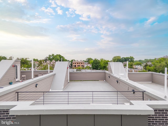 view of patio featuring a balcony