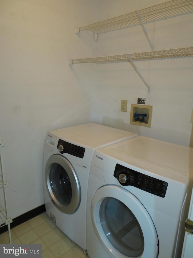 laundry room with washer and dryer