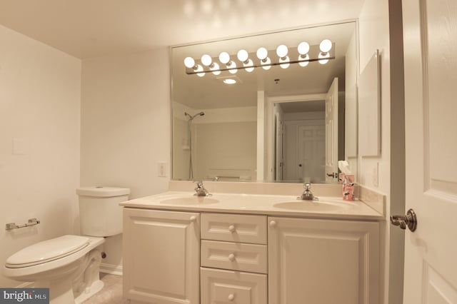 bathroom with vanity, toilet, and tile patterned flooring