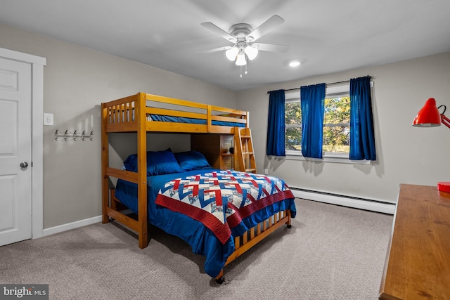 carpeted bedroom featuring baseboard heating and ceiling fan