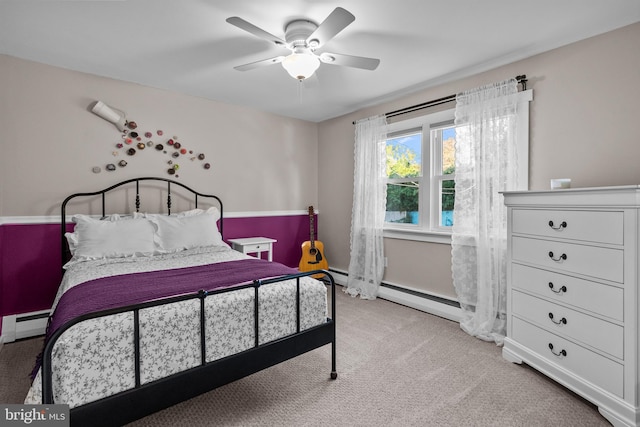 bedroom featuring baseboard heating, light colored carpet, and ceiling fan