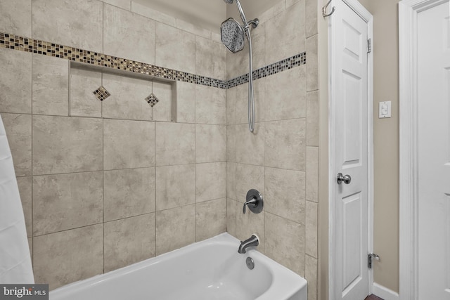 bathroom with shower / bath combo with shower curtain