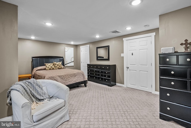 bedroom with light colored carpet