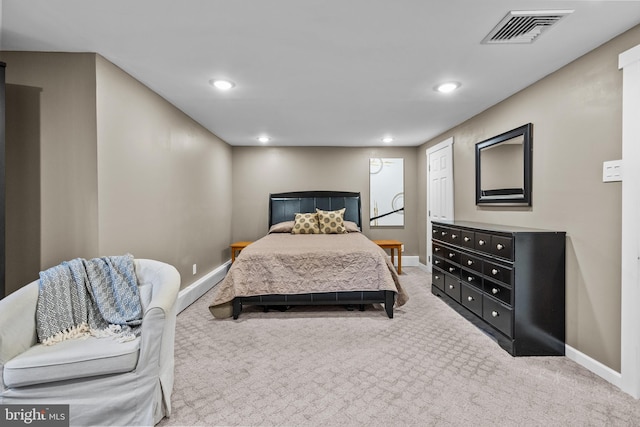 bedroom with light carpet