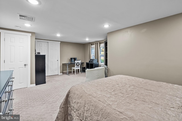 carpeted bedroom with a closet