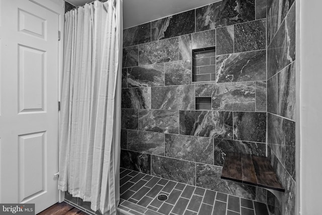 bathroom with a shower with curtain