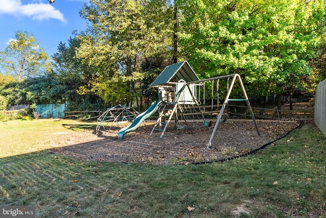 view of playground with a lawn