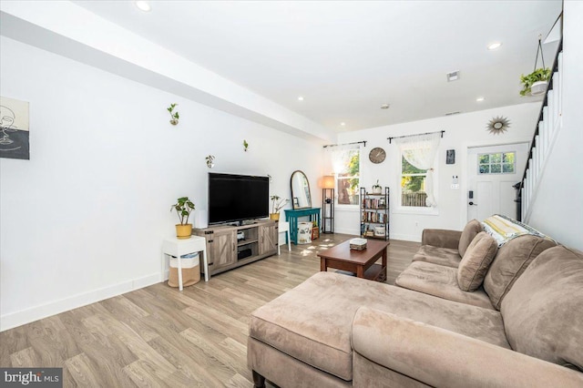 living room with light hardwood / wood-style flooring