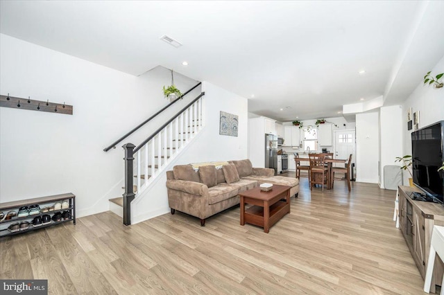 living room with light hardwood / wood-style flooring