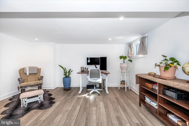 office space with light hardwood / wood-style flooring