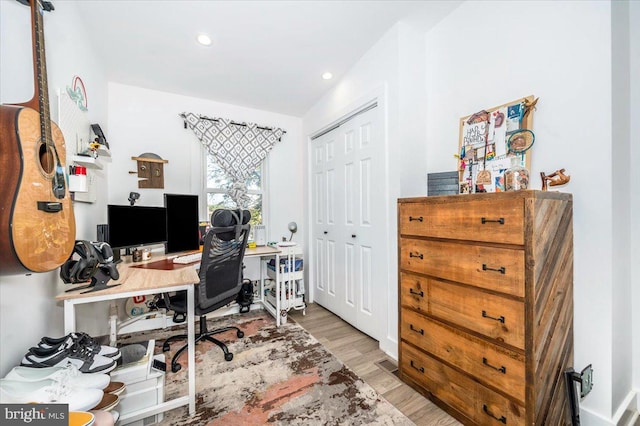 office area with light hardwood / wood-style floors