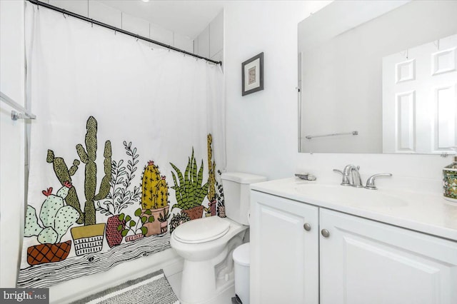 bathroom featuring vanity, toilet, walk in shower, and tile patterned flooring