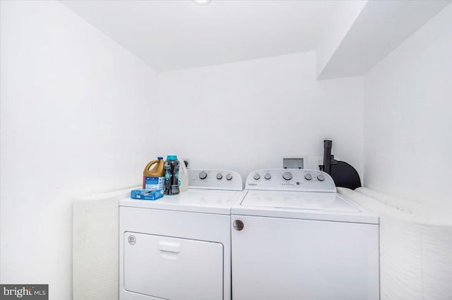 laundry area with separate washer and dryer