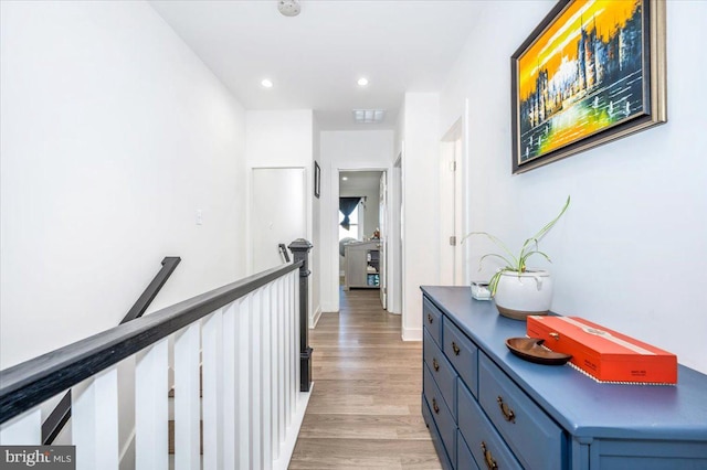 hall with light hardwood / wood-style floors