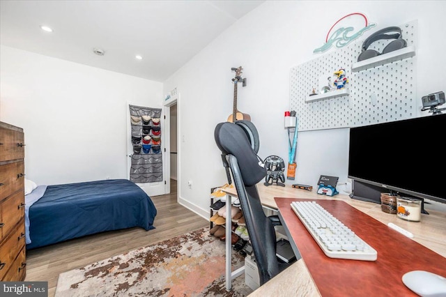 bedroom with hardwood / wood-style floors