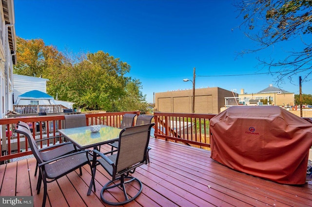 wooden deck with grilling area