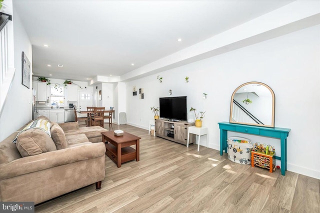 living room with light hardwood / wood-style floors