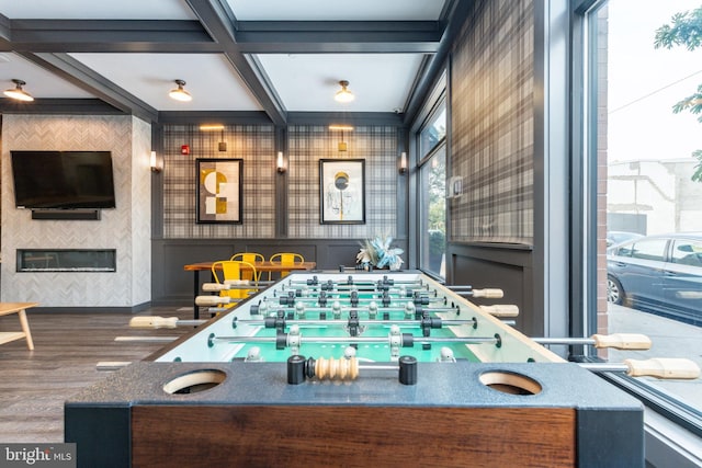 game room featuring beam ceiling, coffered ceiling, and wood-type flooring