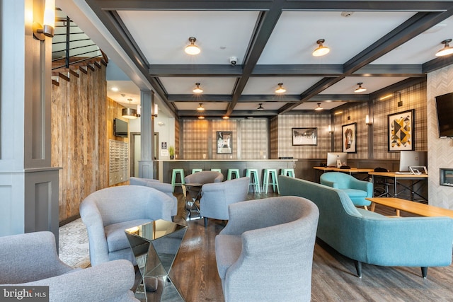 interior space featuring beam ceiling, wood finished floors, and coffered ceiling