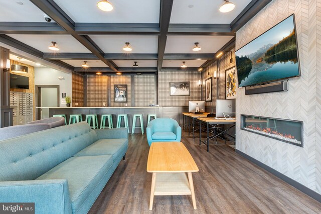 living room with wallpapered walls, wood finished floors, beamed ceiling, and coffered ceiling