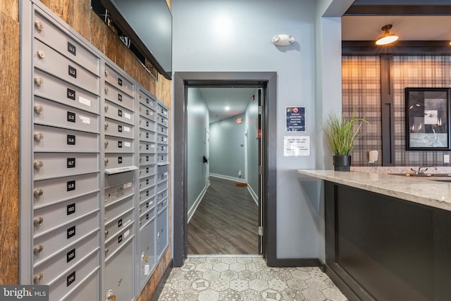 interior space featuring mail boxes and light wood-type flooring