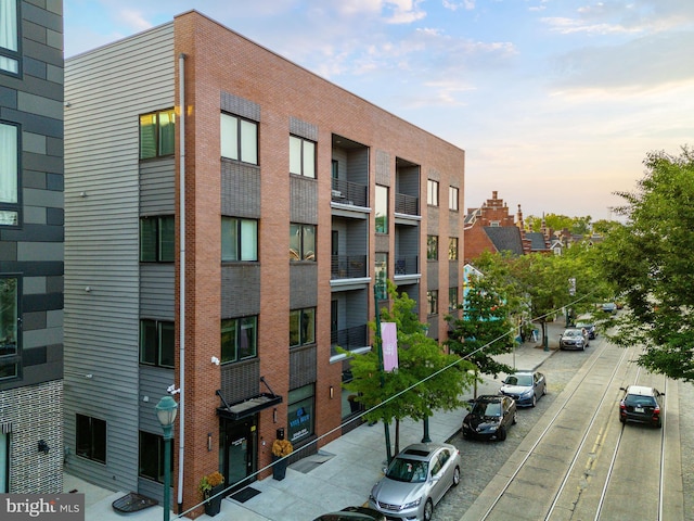 view of outdoor building at dusk