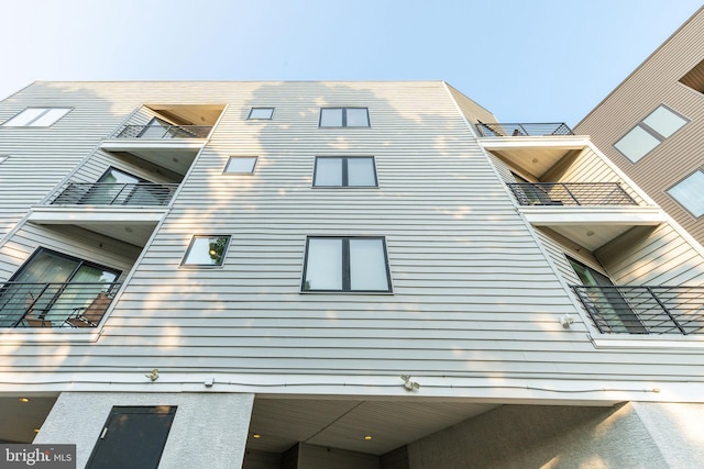 view of side of property with a balcony