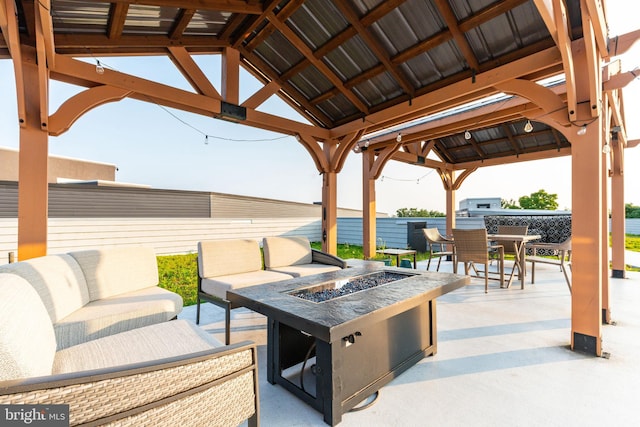 view of patio with a gazebo and a fire pit