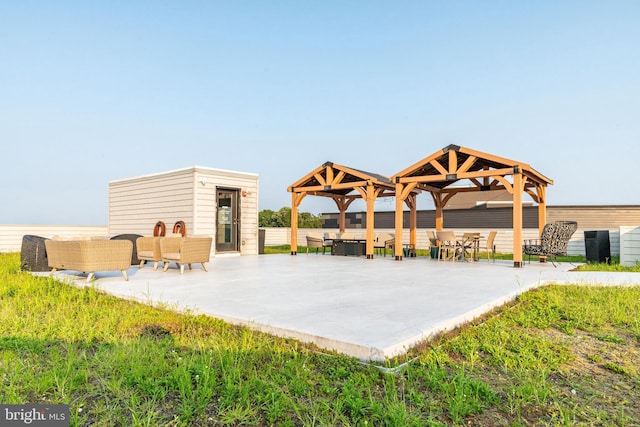 view of community featuring an outdoor living space and a patio area