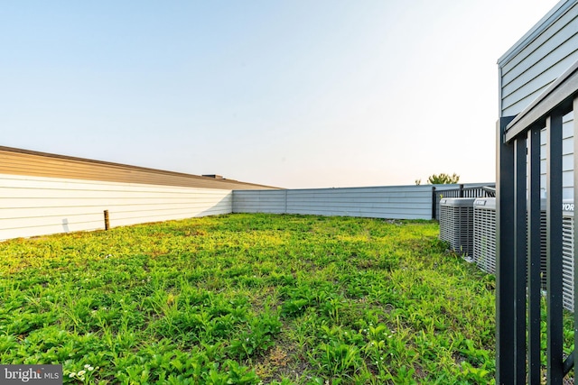 view of yard featuring central air condition unit