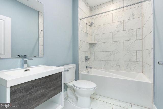 full bathroom with vanity, toilet, and tiled shower / bath combo