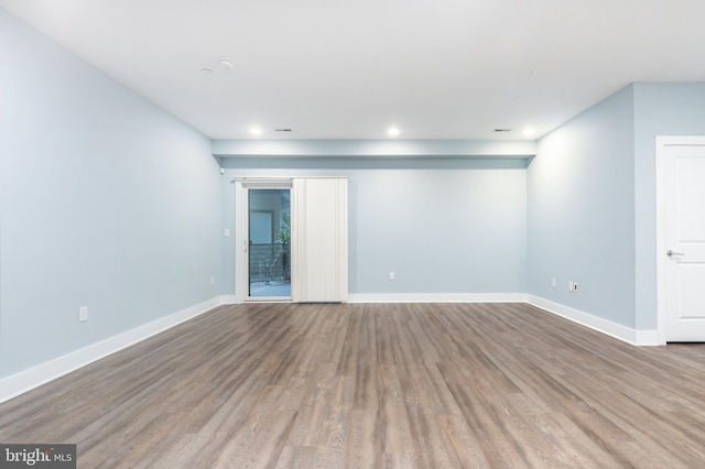 empty room with light hardwood / wood-style floors