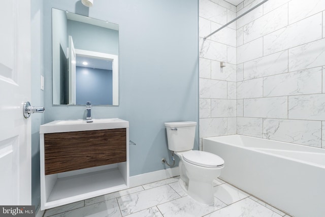 bathroom with washtub / shower combination, baseboards, toilet, vanity, and marble finish floor