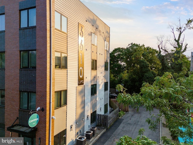 outdoor building at dusk featuring central AC