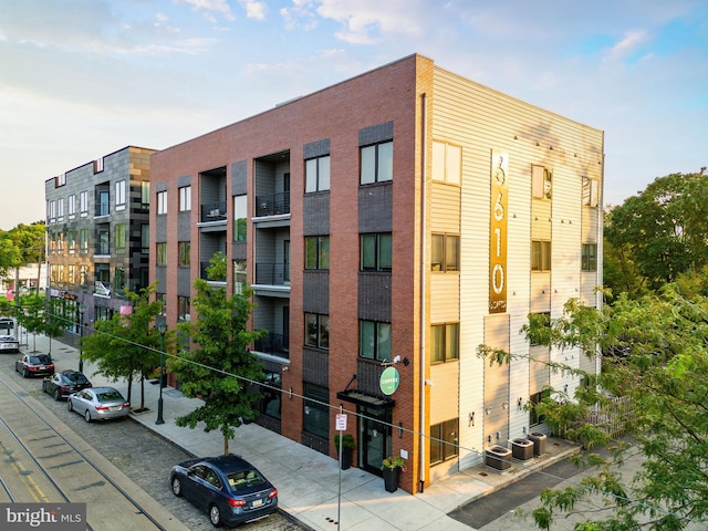 view of building exterior featuring central AC unit